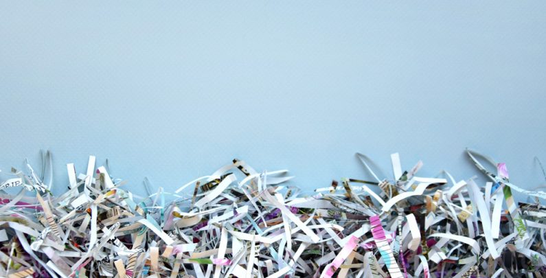 The shredded paper on light blue background.