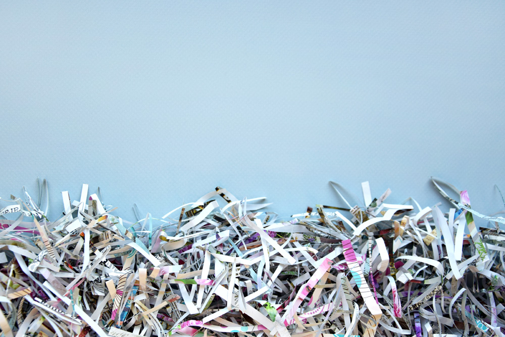 The shredded paper on light blue background.